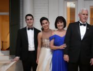 Vice President Mike Pence (C), his wife Karen Pence, their daughters Audrey (2nd L) and Charlotte (2nd R) and their son Michael and his wife Sarah pose for photographs on the front porch of the vice presidential residence at the U.S Naval Observatory before heading to the inaugural balls January 20, 2017 in Washington, DC.