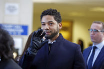 Actor Jussie Smollett waves as he follows his attorney to the microphones after his court appearance at Leighton Courthouse on March 26, 2019 in Chicago, Illinois.