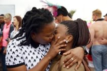 A couple kiss as members of the South African Lesbian, Gay, Bisexual and Transgender (LGBT) community take part in the annual Gay Pride Parade at Durban's North Beach as part of the three-day Durban Pride Festival in Durban on June 27, 2015. AFP PHOTO / RAJESH JANTILAL (Photo credit should read RAJESH JANTILAL/AFP/Getty Images)