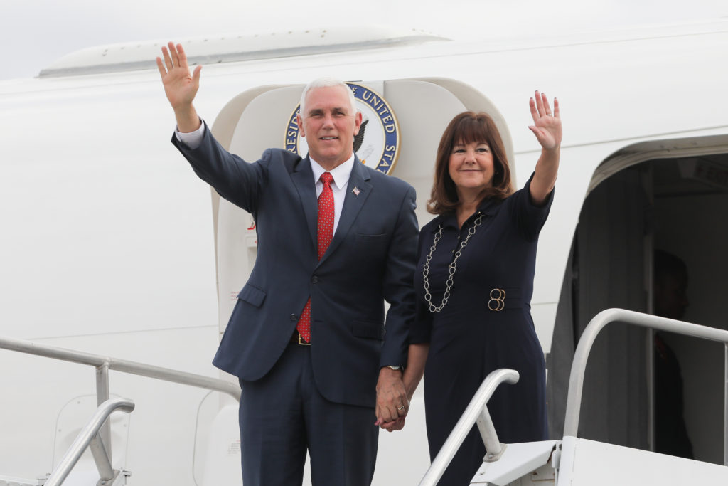 US Vice-President Mike Pence and his wife Karen Pence wave upon landing at a military air base in Brasilia June 26, 2018.
