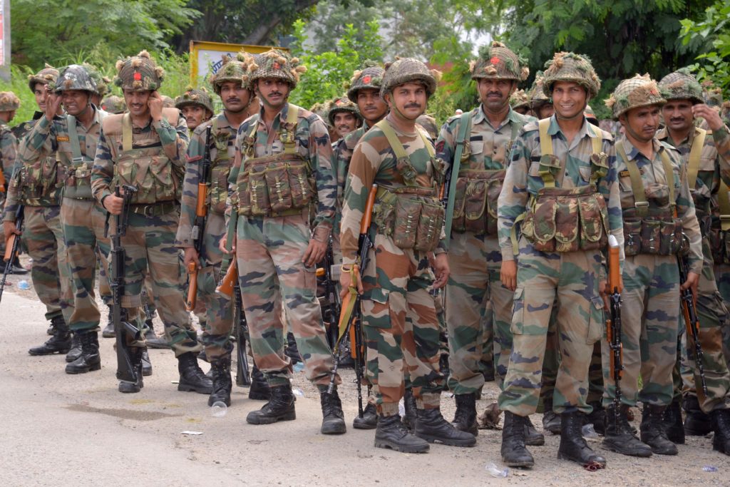 Indian Army personnel stand guard in the Gurdaspur district of Punjab state