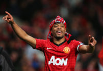 Patrice Evra of Manchester United celebrates victory and winning the Premier League title after the Barclays Premier League match between Manchester United and Aston Villa at Old Trafford on April 22, 2013 in Manchester, England.