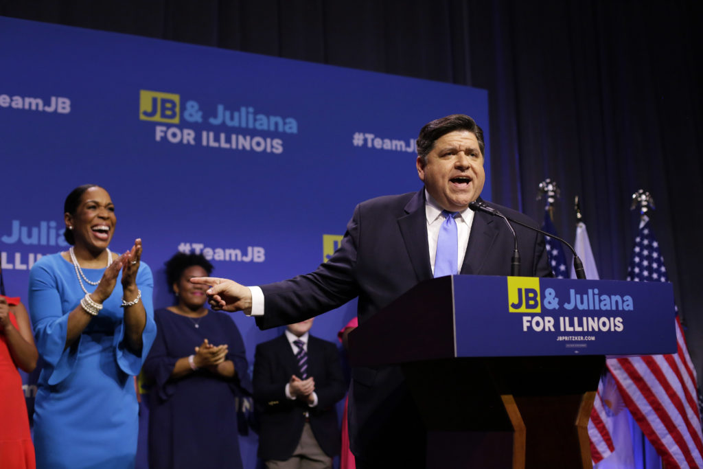 Illinois Democratic candidate for Governor J.B. Pritzker and his Lieutenant Governor pick Juliana Stratton arrive during his primary election night victory speech on March 20, 2018 in Chicago, Illinois.
