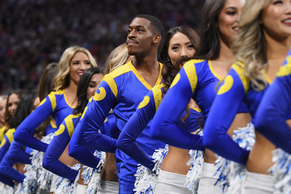 Los Angeles Rams cheerleader Quinton Peron looks on during Super Bowl LIII against the New England Patriots at Mercedes-Benz Stadium on February 3, 2019 in Atlanta, Georgia.