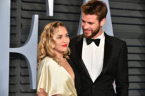 Miley Cyrus (L) and Liam Hemsworth attend the 2018 Vanity Fair Oscar Party hosted by Radhika Jones at Wallis Annenberg Center for the Performing Arts on March 4, 2018 in Beverly Hills, California.