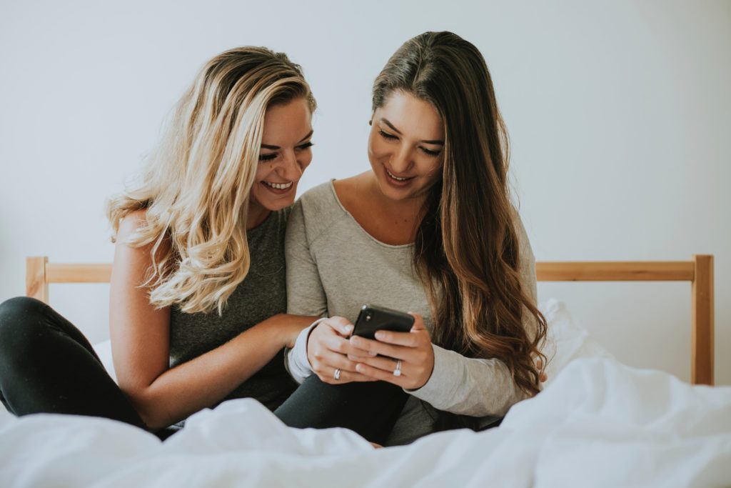 Women look at their mobiles, but they may have enter personal details to look at porn.