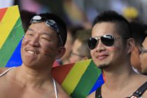 Participants pose at the square outside the presidential office before the start of a gay pride parade in Taipei, Taiwan on October 27, 2018.