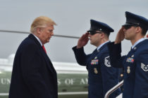 Photo of President Trump and Air Force personnel.