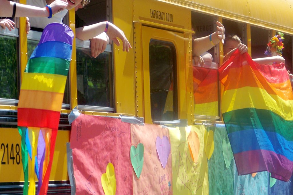 A Gay-Straight Alliance school bus takes part in a Pride parade