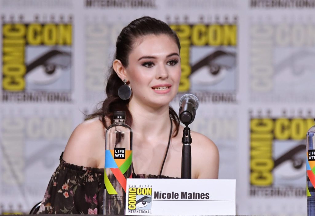 Nicole Maines walks onstage at the Supergirl Q&A during Comic-Con (Mike Coppola/Getty)