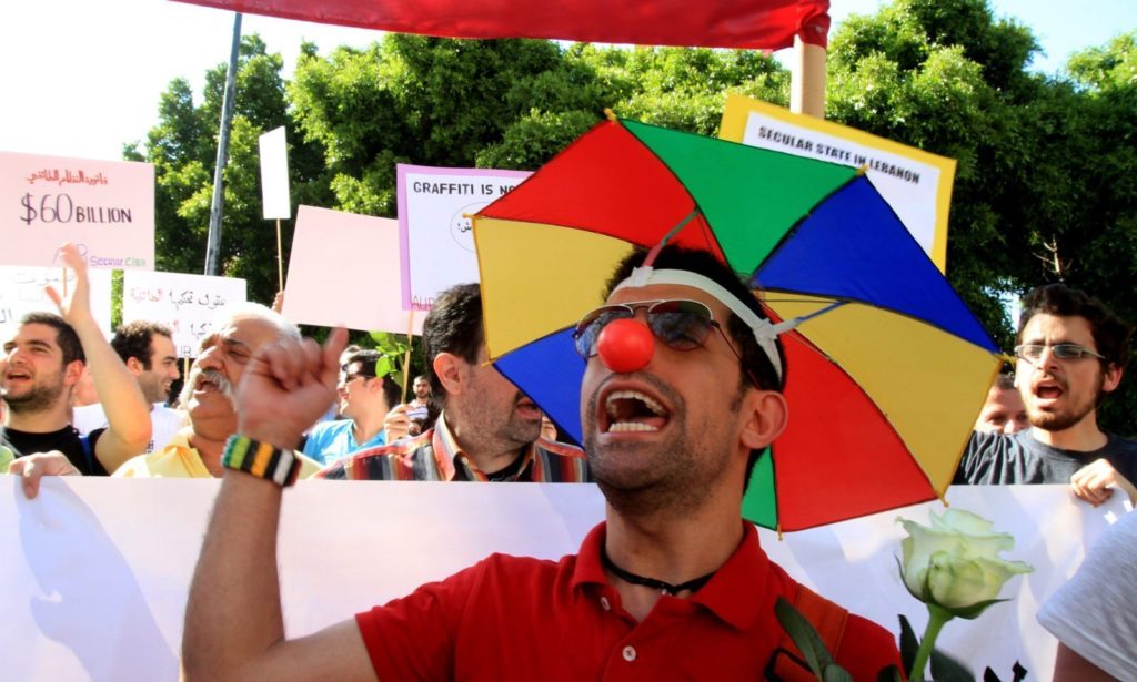 Lebanese demonstrators shout slogans during the Laique Pride III march, calling for equality amongst all Lebanese citizens in Beirut on May 6, 2012. The Laique Pride encourages and supports every movement and organization working towards a more egalitarian society and seeks to inspire new citizen initiatives in Lebanon. AFP PHOTO / ANWAR AMRO (Photo credit should read ANWAR AMRO/AFP/GettyImages)
