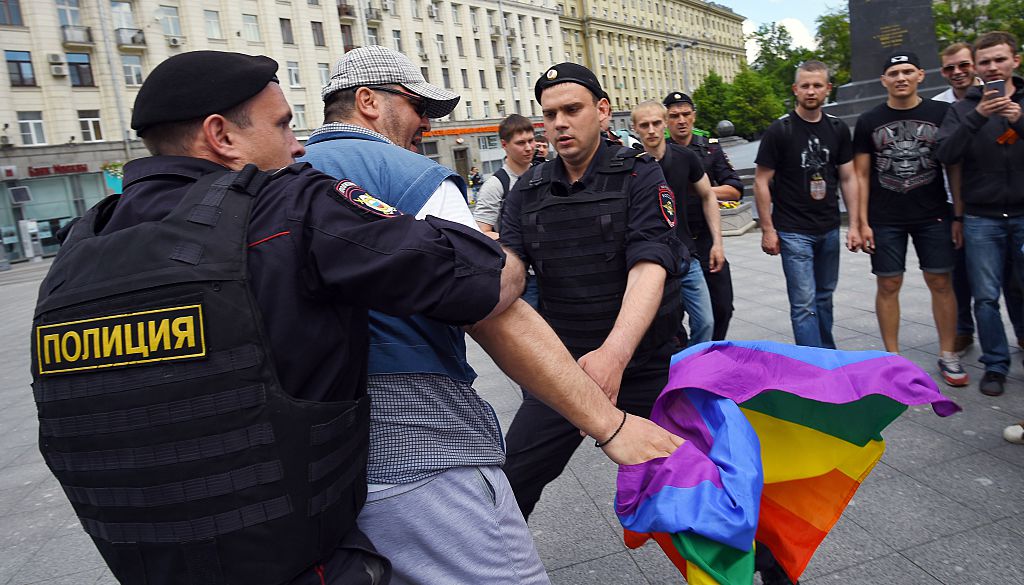 Russian riot policemen detain a gay and LGBT rights activist during an unauthorized gay rights activists rally in central Moscow on May 30, 2015. Moscow city authorities turned down demands for a gay rights rally. AFP PHOTO/DMITRY SEREBRYAKOV (Photo credit should read DMITRY SEREBRYAKOV/AFP/Getty Images)