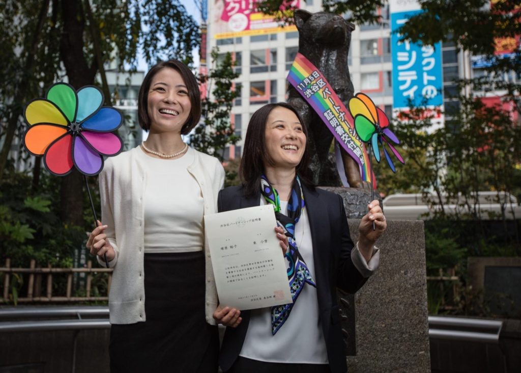 TOKYO, JAPAN - NOVEMBER 05: Japanese couple Koyuki Higashi (L) and Hiroko Masuhara (R) celebrate as hold up their same-sex marriage certificate in front of Shibuya's Hachiko statue on November 5, 2015 in Tokyo, Japan. Shibuya Ward in the Tokyo became the first local government in Japan to issue the official certificates recognizing same-sex partnerships. (Photo by Christopher Jue/Getty Images)