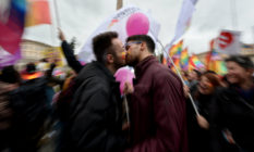 Supporters of LGBT associations kiss as they take part in a protest in central Rome on 5 March 2016.