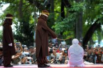 A woman in Aceh is caned 100 times for having sex outside marriage (CHAIDEER MAHYUDDIN/AFP/Getty)