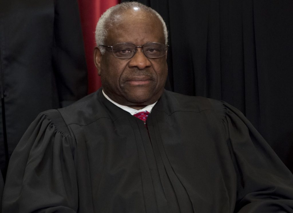 US Supreme Court Associate Justice Clarence Thomas sits for an official photo with other members of the US Supreme Court in the Supreme Court in Washington, DC, June 1, 2017. / AFP PHOTO / SAUL LOEB (Photo credit should read SAUL LOEB/AFP/Getty Images)
