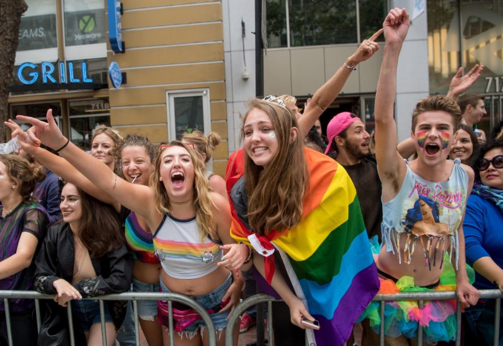 Ciara Hall (L) cheers with friends during the San Francisco Pride parade in San Francisco, California on Sunday, June, 25, 2017. / AFP PHOTO / Josh Edelson (Photo credit should read JOSH EDELSON/AFP/Getty Images)
