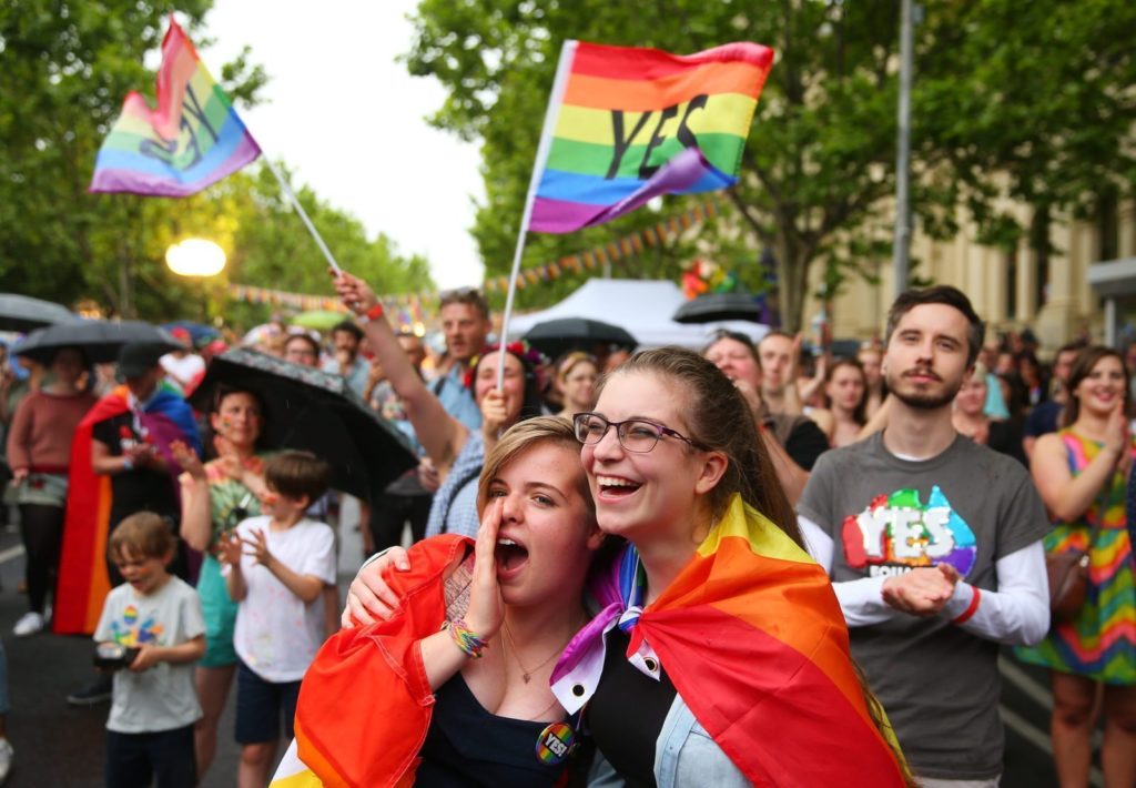 MELBOURNE, AUSTRALIA - NOVEMBER 15: Supporters of the 'Yes' vote for marriage equality celebrate at Melbourne's Result Street Party on November 15, 2017 in Melbourne, Australia. Australians have voted for marriage laws to be changed to allow same-sex marriage, with the Yes vote claiming 61.6% to to 38.4% for No vote. Despite the Yes victory, the outcome of Australian Marriage Law Postal Survey is not binding, and the process to change current laws will move to the Australian Parliament in Canberra. (Photo by Scott Barbour/Getty Images)