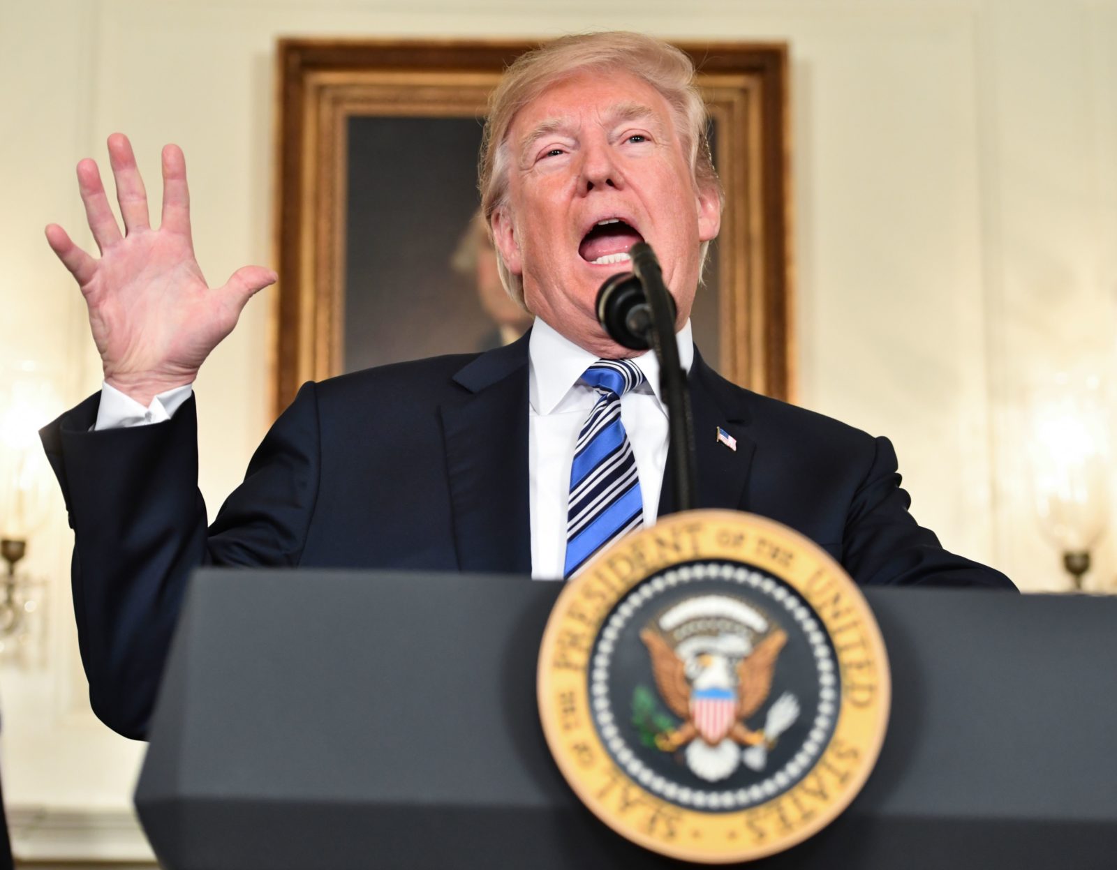 TOPSHOT - US President Donald Trump speaks about the spending bill during a press conference in the Diplomatic Reception Room at the White House on March 23, 2018. / AFP PHOTO / Nicholas Kamm (Photo credit should read NICHOLAS KAMM/AFP/Getty Images)