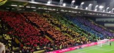 Watford FC fans make a huge Pride flag in the stands