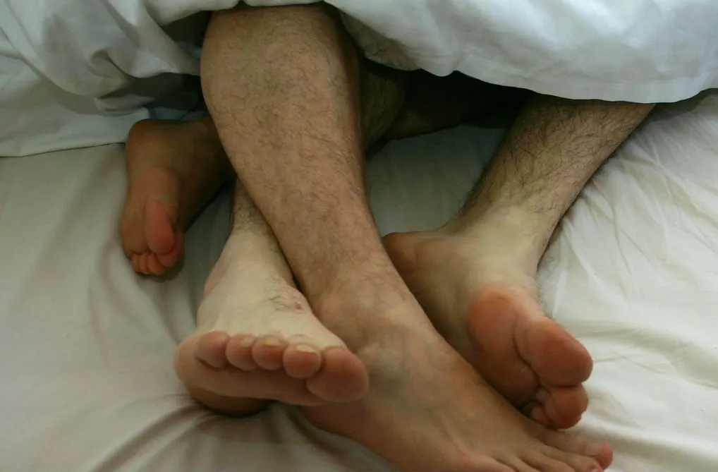 A gay couple in bed