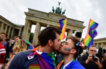TOPSHOT - Two men kiss as they attend a rally of gays and lesbians in front of the Brandenburg Gate in Berlin on June 30, 2017. The German parliament legalised same-sex marriage, days after Chancellor Angela Merkel said she would allow her conservative lawmakers to follow their conscience in the vote. / AFP PHOTO / Tobias SCHWARZ (Photo credit should read TOBIAS SCHWARZ/AFP/Getty Images)