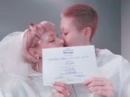 Jackie Chan's daughter Etta Ng and Andi Autumn pose with their wedding certificate