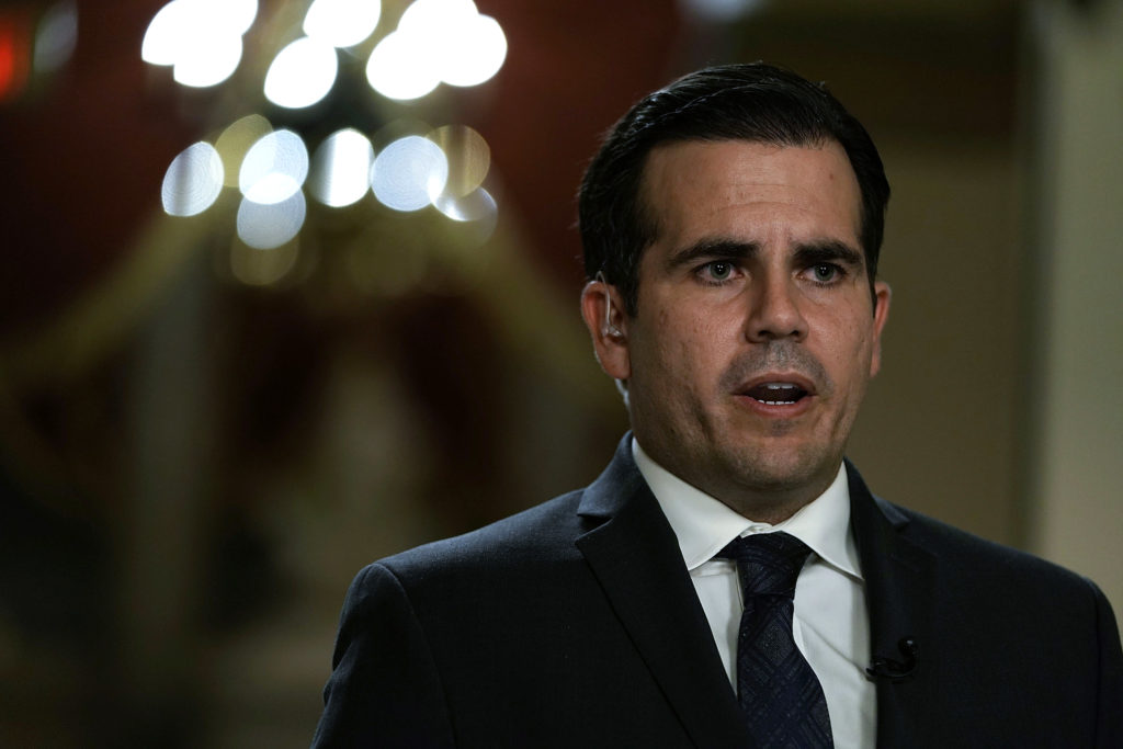 Puerto Rico governor Ricardo Rossello is interviewed by a TV channel after a House vote at the Capitol December 21, 2017 in Washington, DC. 