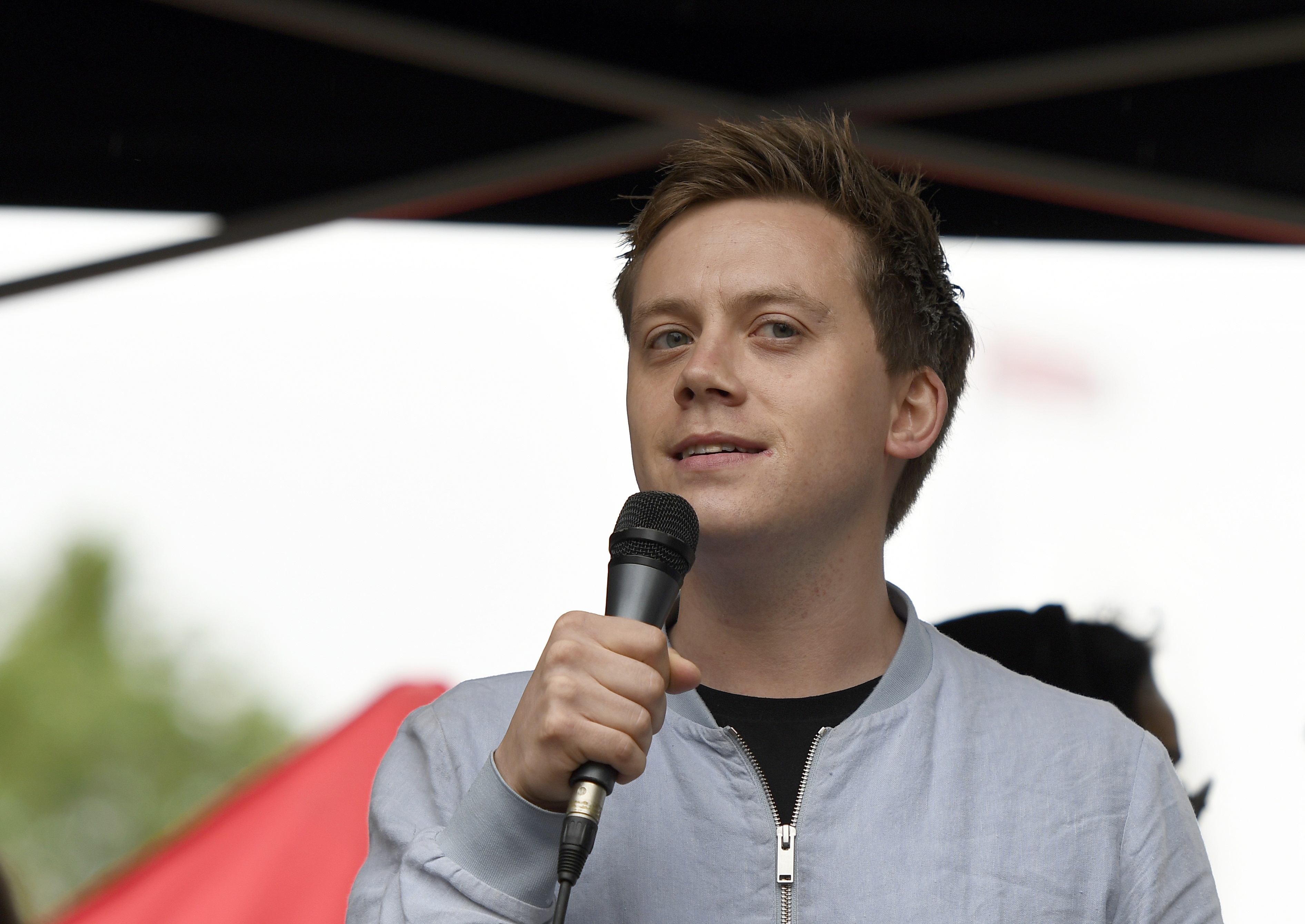 Guardian columnist Owen Jones speaks to the crowd during an Anti-Trump protest in London.