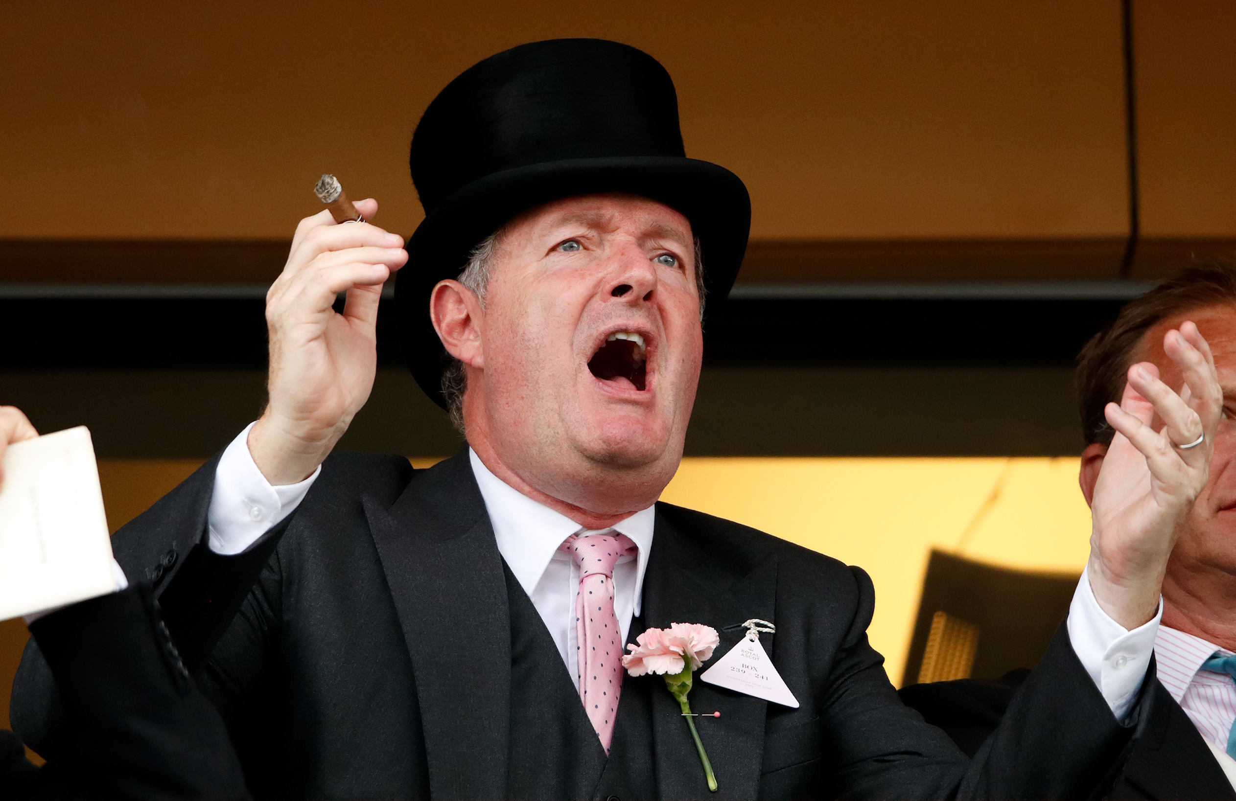 Piers Morgan smokes a cigar whilst watching the racing on day two of Royal Ascot at Ascot Racecourse on June 19, 2019 in Ascot, England.