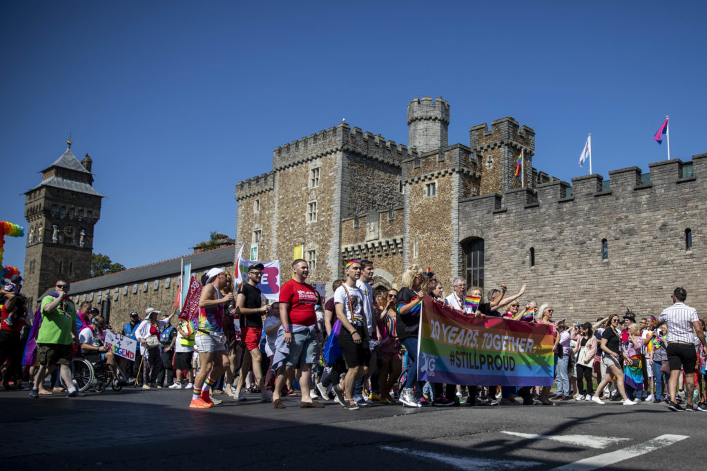 Cardiff, Wales, UK, August 24th 2019. The head of the Welsh parade passes Cardiff Castle during the Pride Cymru parade as part of a weekend of celebrations on the 20th anniversary of the event. (Photo credit should read Mark Hawkins/Composed Images / Barcroft Media via Getty Images)