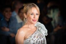 Kylie Minogue wearing an off the shoulder embellished dress