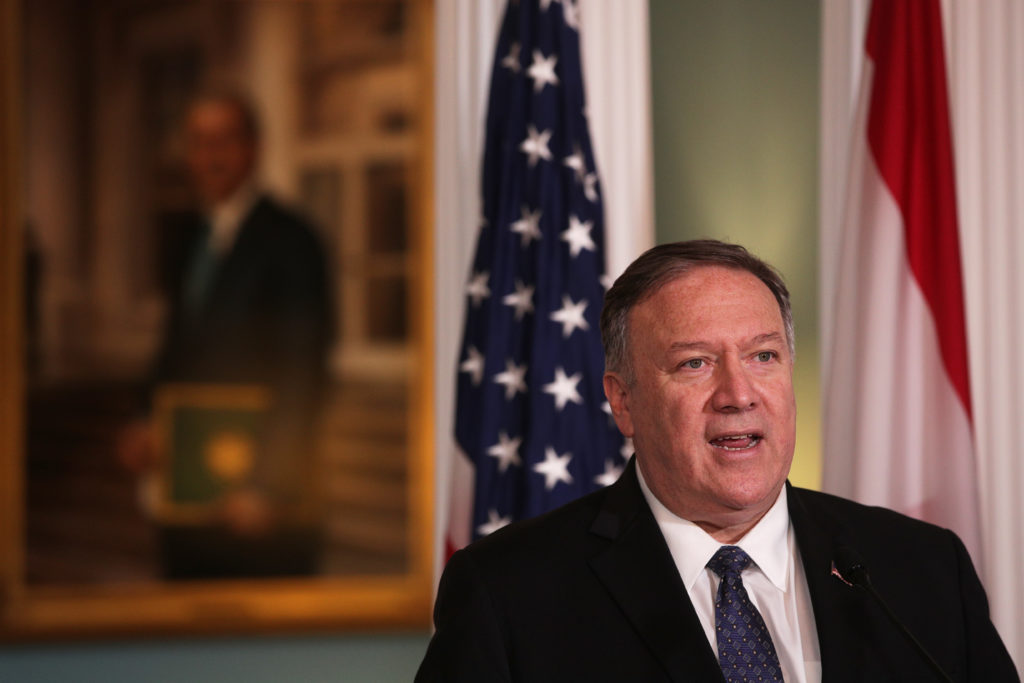 Mike Pompeo in front of a US flag