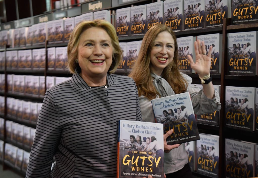 Former US Secretary of State and First Lady Hillary Rodham Clinton (L) and Chelsea Clinton arrive to the book signing of their new book "The Book of Gutsy Women: Favorite Stories for Courage and Resilience" at Barnes & Noble Union Square on October 3, 2019 in New York City. (ANGELA WEISS/AFP via Getty Images)