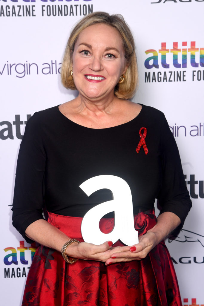 Ruth Coker Burks poses with the Attitude Hero Award. (Dave J Hogan/Getty Images)