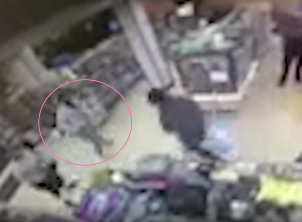In CCTV footage, the man (highlight by a pink circle) is beelined by two men in a 7-Eleven. (Screen capture via NBC10)
