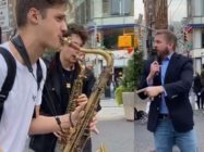 'Homophobic' hate preacher drowned out by street performers with saxophones