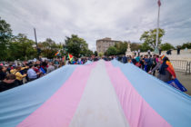 A giant trans flag outside the US Supreme Court as a community response to the landmark Supreme Court hearings that could legalise workplace discrimination against LGBTQ+ people