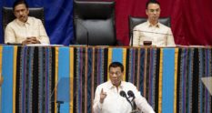 Philippine President Rodrigo Duterte gestures as he delivers his state of the nation address, as Senate President Vicente Sotto the III (top L) and House Speaker Alan Peter Cayetano (top R) look on at Congress. (NOEL CELIS/AFP via Getty Images)