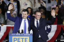 Democratic presidential candidate Pete Buttigieg waves with his husband Chasten Buttigieg after addressing supporters at his caucus night watch party on February 03, 2020 in Des Moines, Iowa. (Tom Brenner/Getty Images)