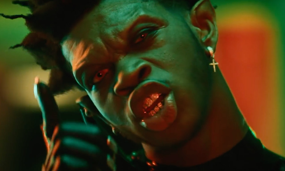 Lil Nas X with sharp vampire teeth