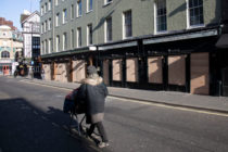 Bars and restaurants boarded up and closed down on Old Compton Street in Soho, at the heart of the West End