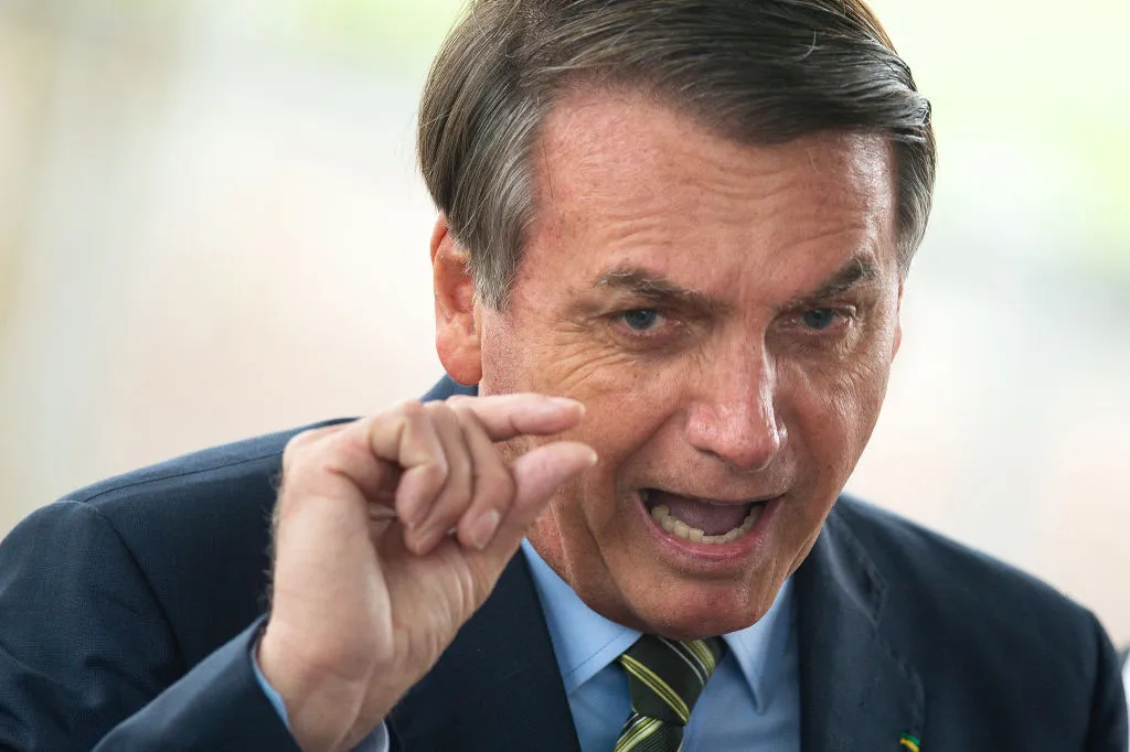 Brazilian President Jair Bolsonaro gestures during a press conference amidst the coronavirus (COVID - 19) pandemic.