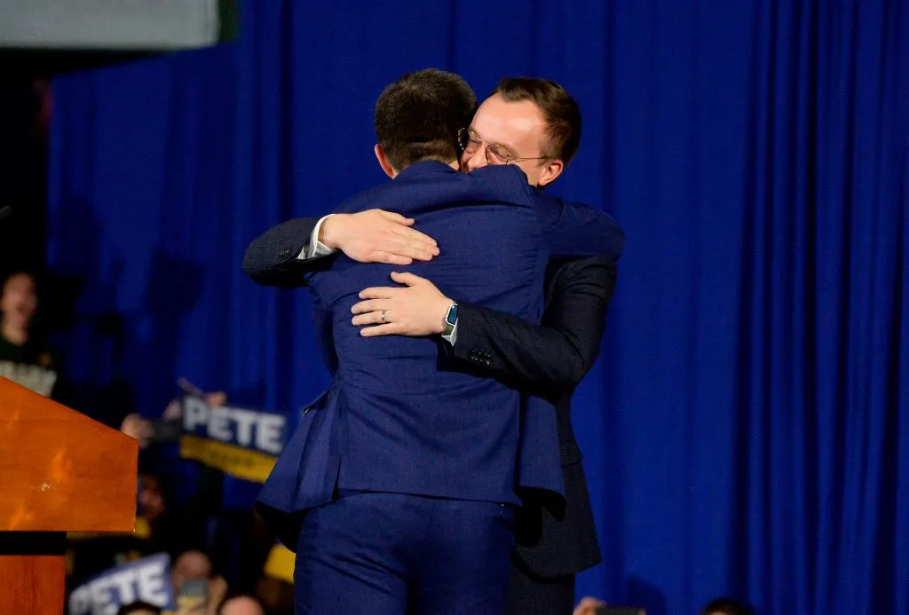 Former US Presidential candidate Pete Buttigieg hugs his husband Chasten Buttigieg 