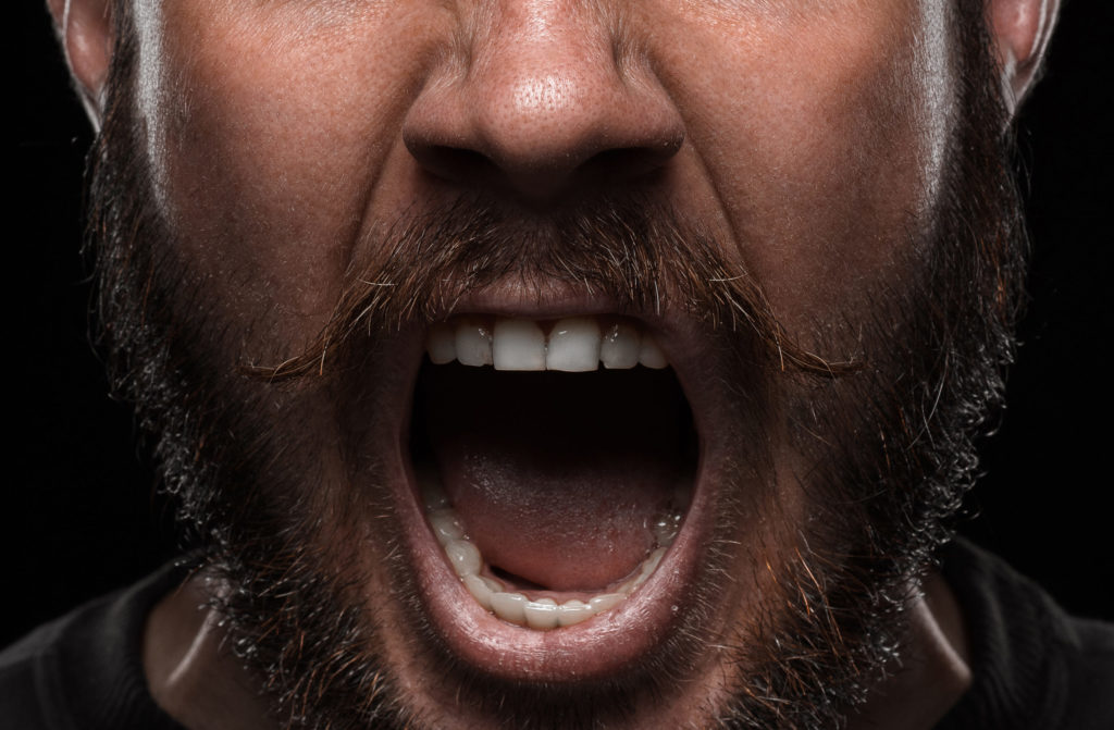 Close-up portrait of angry man