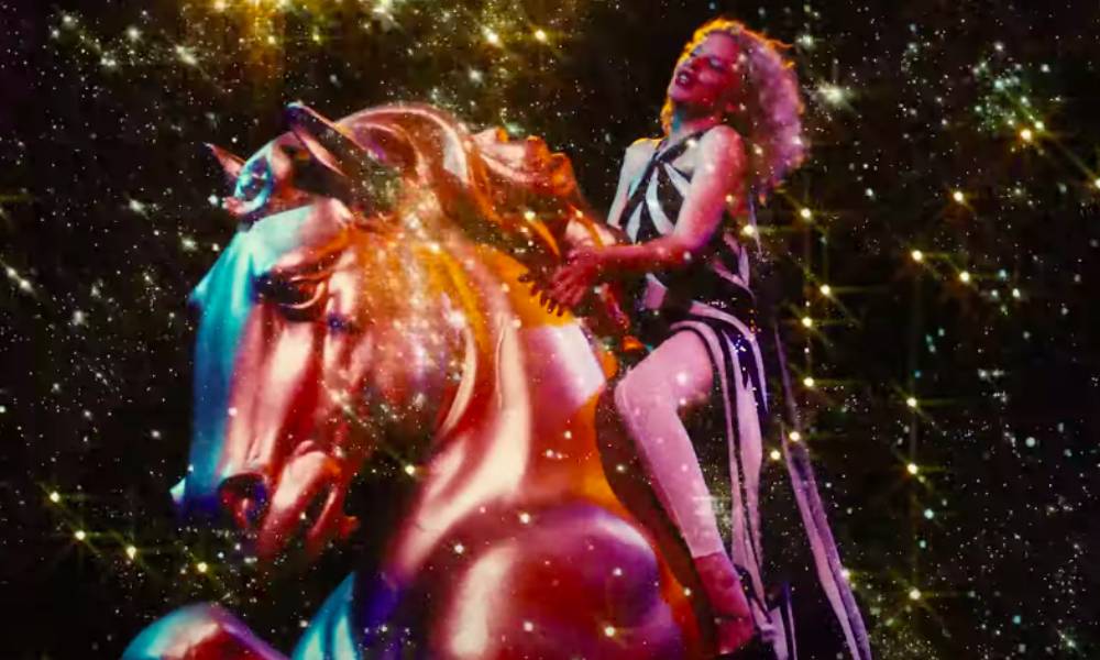 Kylie Minogue atop a bronze horse