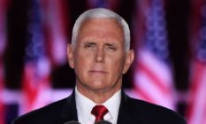 Mike Pence in front of USA flags