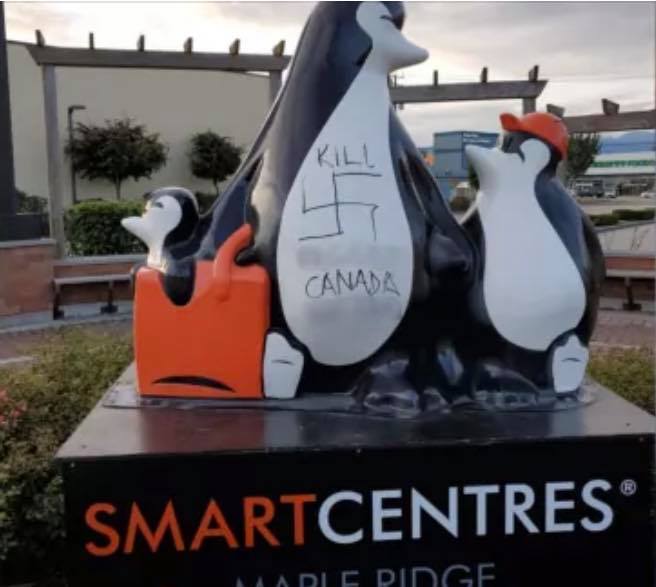 Penguin statue vandalised with vile homophobic slurs and swastikas