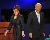 Sarah Palin and Democrat Joseph Biden walk on stage following their vice presidential debate