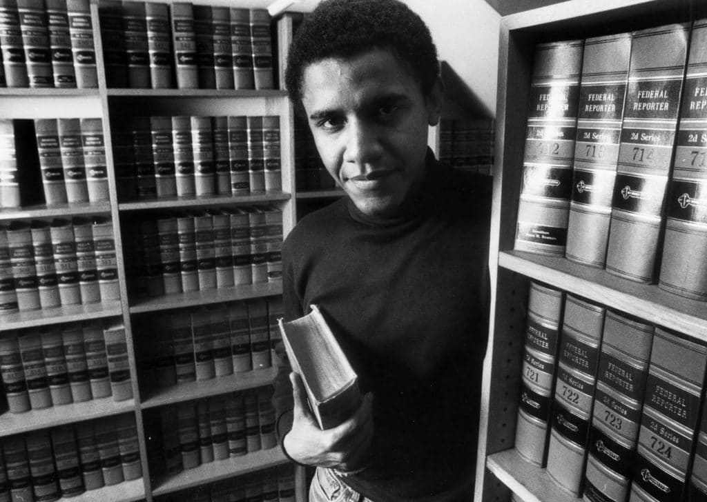A young Barack Obama poses in the office of The Harvard Law Review